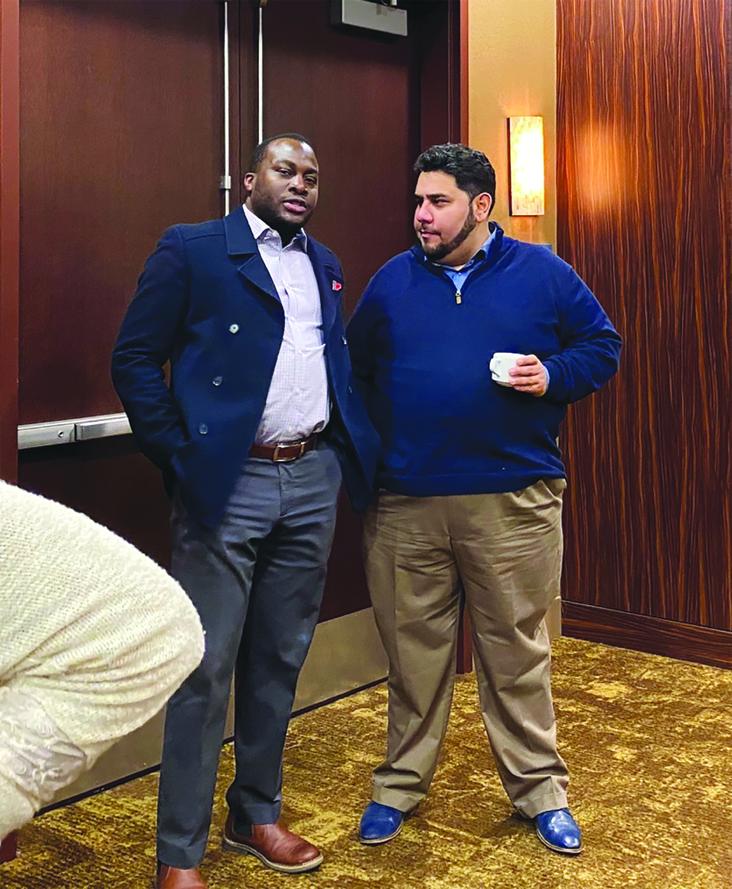 Waheed Gbadamosi, private banker for BancFirst, and Alberto Rivas Jr., district manager/assistant vice president of City National Bank and Trust, visit for a minute during the January Breakfast Before Business event at the Apache Casino Hotel.
