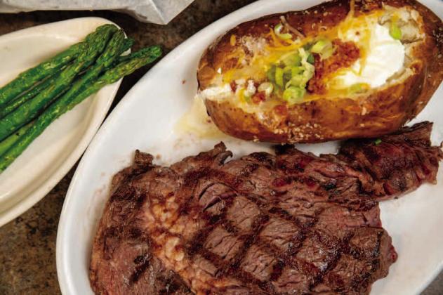 One of the restaurant’s featured entrées combines a grilled ribeye with a loaded baked potato and asparagus. Hannah Owens | Southwest Ledger