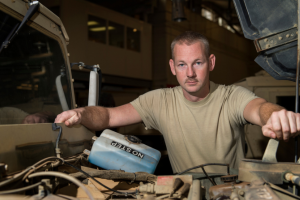 U.S. Air Force photo by Staff Sgt. Kenneth W. Norman               U.S. Air Force Tech. Sgt. Robert Black, the Vehicle Maintenance NCO in charge assigned to the 97th Logistics Readiness Squadron, poses for a portrait at the 97th LRS vehicle maintenance shop, Feb. 9, 2018, at Altus Air Force Base. Black has been assigned to the 97th Air Mobility Wing for nearly 15 years and is hoping to finish out his career at Altus AFB.