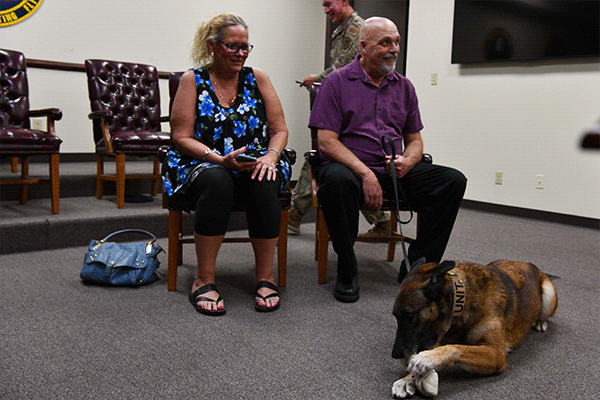 Kim and Robin Boren sit with Yyoda/P195, a U.S. Air Force ret. explosivedetectionMilitaryWorkingDogs,afterhisretirementcer- emony on Sept. 11, 2019, at Altus Air Force Base. Since Yyoda’s new owner was not able to make the ceremony herself, her par- ents, Robin and Kim, handed over Yyoda during the ceremony and will be flying with Yyoda to Hawaii so he can be with his new owner. (U.S. Air Force photo by Airman 1st Class Dallin Wrye)