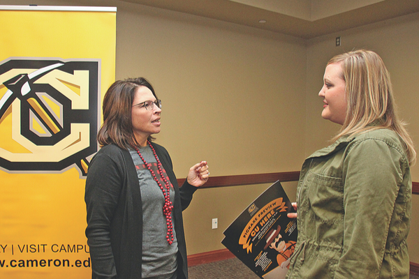 Tammy Fritz, left, Cache, and Miranda Lopez, Elgin, were just two of the high school counselors from southwest Oklahoma who attended Cameron University’s recent Counselor’s Breakfast. The two found time to chat during a break in the morning’s activities.