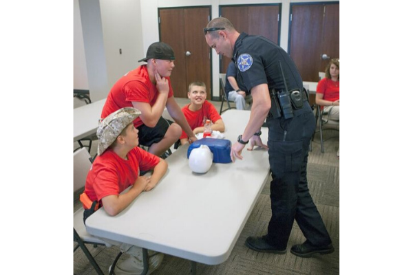 Community outreach and safety is a priority for the Lighthorse Police Department. Officers teach basic CPR during the youth police academy.