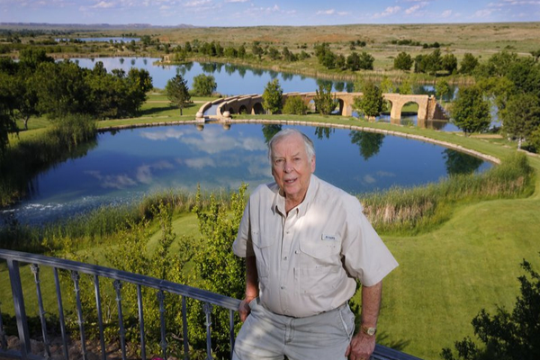 In this May 30, 2017, file photo, oil tycoon T. Boone Pickens poses for a photo on his Mesa Vista Ranch in the panhandle of Texas. An ornate conference-room table where the late legendary oil tycoon Pickens made billion-dollar deals and hosted VIPs in his Dallas office is heading to the Oklahoma State Capitol. Officials at Oklahoma State University announced Wednesday, Oct 9, 2019, the 24-foot-long table and 22 leather chairs will be loaned to the governor’s office for the next 10 years. 