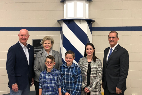 State Reps. Mark Vancuren, Sheila Dills, Kelly Albright and Tom Gann visit with Pryor schools’ students Trace and Eli about the district’s workforce development programs.