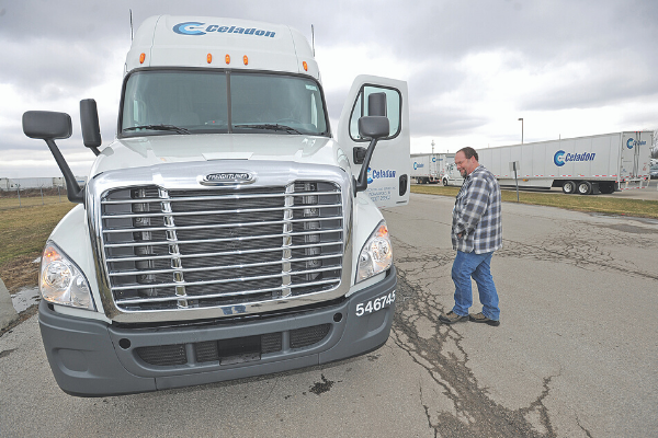 AP Photo by Matt Kryger/The Star Brian Caldwell gives a semi-truck a pre-drive inspection at Celadon Trucking in Indianapolis.