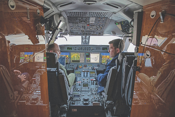 Airmen receive the opportunity to observe the inside the cockpit of a C-37B Gulfstream assigned to the 89th Airlift Squadron during a squadron visit on Nov. 7 at Altus Air Force Base. The 89th Airlift Wing maintains 24/7 alert, operating the Executive Airlift Training Center and Government Network Operation Center.