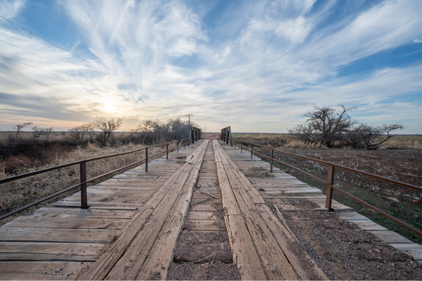 Built in 1913, this bridge south of Altus has a timber plank deck and a roadway just 151⁄2 feet wide.