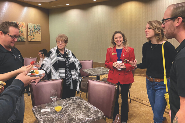 Heather Wheeler (second from the right), general manager for Viridian Coffee’s 2nd Street location, visits with other chamber members.