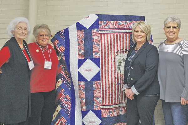 While celebrating the organization’s 13th anniversary, Great Plains Republican Women gave gifts to two local beneficiaries – Pregnancy Resource Center of Southwest Oklahoma and the Veterans Center. GPRW also announced it is raising funds for another campaign by raffling off this custom made queen-size quilt. The group lends its support to organizations throughout the community and promotes conservative principles. Ledger photo by Curtis Awbrey