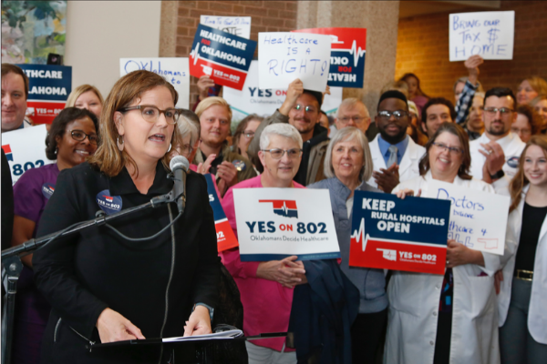 Amber England, who headed the campaign to put Medicaid expansion on the ballot in Oklahoma, speaks before supporters of Yes on 802 Oklahomans Decide Healthcare deliver petitions to the Oklahoma Secretary of State’s office, Thursday, Oct. 24, 2019, in Oklahoma City. The signatures of about 178,000 registered voters are needed to get the question on the ballot, and supporters say they obtained about 313,000 signatures. (AP Photo/Sue Ogrocki)