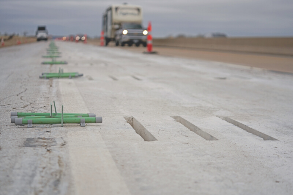 Metal dowel bars are ready for placement in grooves cut into the H.E. Bailey Turnpike as part of a $13.76 million project to rehabilitate the pavement of the aging toll road. Ledger photos by Chris Martin