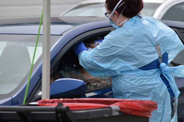 Residents of Oklahoma get tested at the drive-up COVID-19 test site in Norman April 9. Photo by Michael Kinney