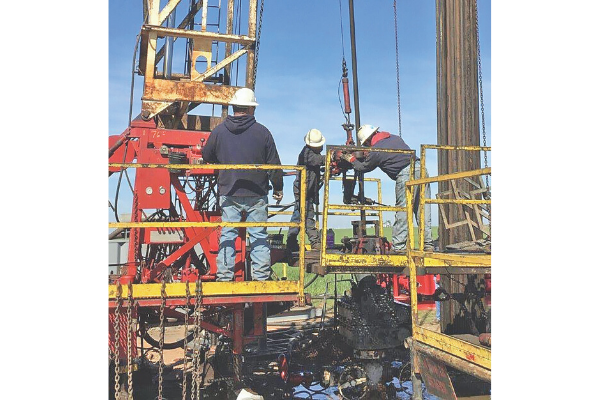 A crew from Morgan Well Service, of Prague, repairs a hole in the casing at a 10,000-foot-deep gas well outside Tuttle in 2017. Ledger file photo by Mike W. Ray 