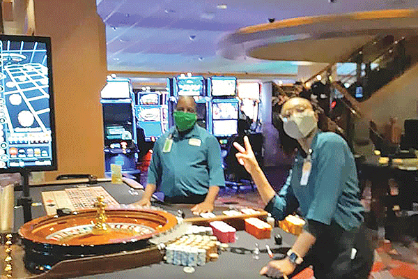 Table game workers wear face mask inside the Apache Casino and Hotel in Lawton. the casino reopens May 21. 