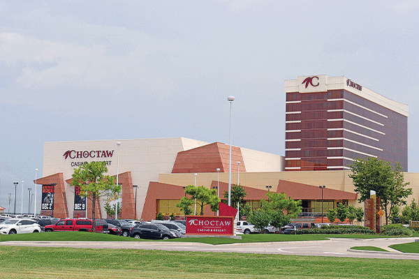 Vehicles are parked outside the Choctaw Casino Resort in Durant. The Choctaw Nation is one of nine tribes involved in a lawsuit against the state of Oklahoma over the model state-tribal gaming compact.