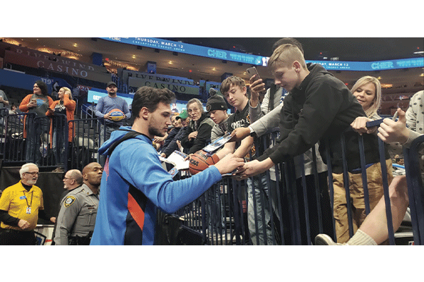 Oklahoma City Thunder Forward Danilo Gallinari signs autographs for fans after an NBA game at Chesapeake Energy Arena in Oklahoma City. 