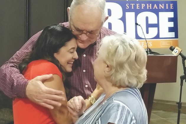 State Sen. Stephanie Bice receives a hug from her parents during a watch party in Oklahoma City Tuesday night. Ledger photo by Andrew W. Griffin