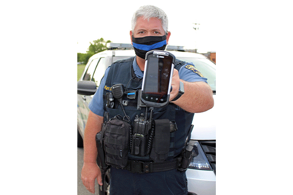 Sgt. Chris Tally of the Lawton Police Department displays a Zebra eCitation electronic ticket-writer.