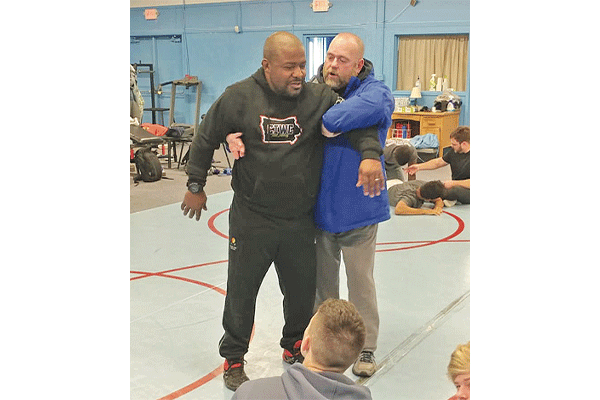Dwight Hinson, left, coaches the Central Iowa Wrestling Club and Team Intensity, a wrestling program for youth in Ames. Hinson will be inducted into the Glen Grand Wrestling Hall of Fame of Iowa in 2021.