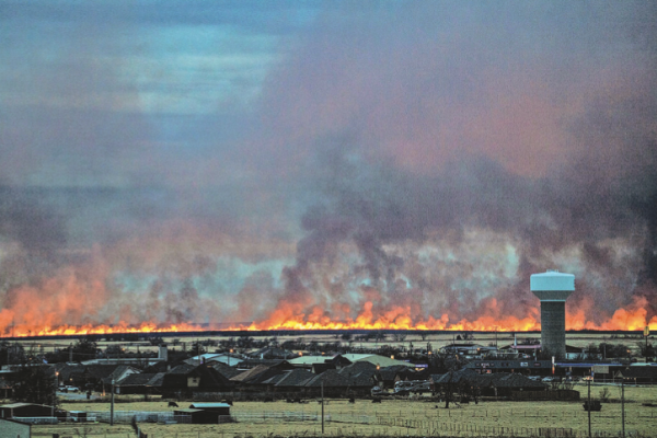 Ledger photo by Steve Booker         The Elgin skyline is visible through smoke and flames arising from a fire at Fort Sill that was sparked by Army ordnance disposal activities.