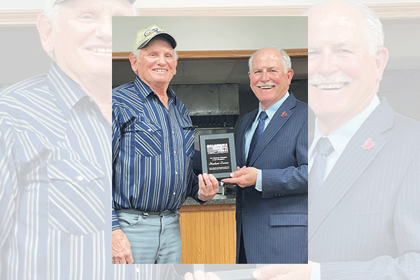 For his 50 years of service to the community, East Duke Town Councilman and Vice Mayor Herbert Turner, left, is pinned and presented with a citation from the Oklahoma Municipal League at Tuesday’s town council meeting. 