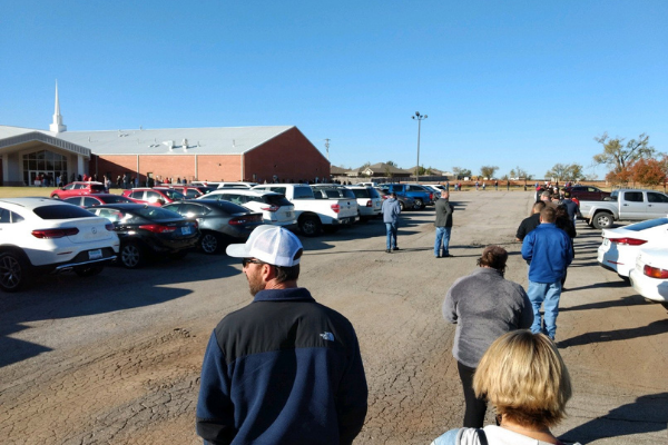 Ledger photo by Bryan M. Richter A line of voters stretches along the perimeter of the parking lot outside the polling place at Southmoore Baptist Church in Moore during the presidential election Nov. 3, 2020.