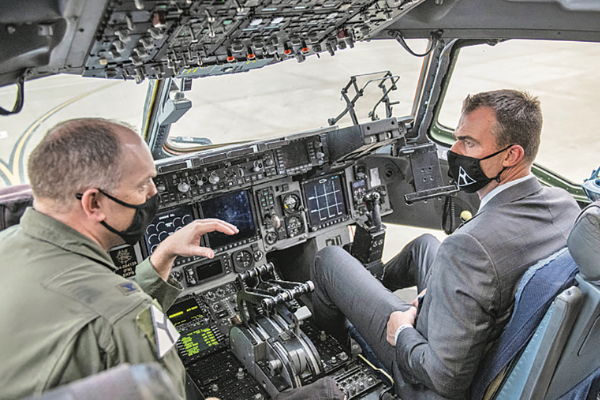 Col. Leard, left, talks to Gov. Stitt on a C-17 Globemaster III at Altus AFB. The C-17 is one of the three mobility airframes used for training at the base.