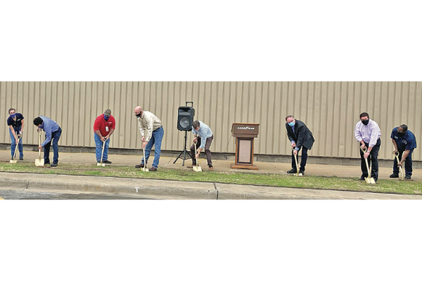 LEDGER PHOTO BY KYLETTA RAY Workers and executives with Goodyear Tire break ground of the site of a 45,000-square-foot building at the site of the company’s Lawton plant Tuesday.
