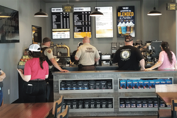 LEDGER PHOTO BY ANDREW W. GRIFFIN Customers wait for their orders inside Black Rifle Coffee Co.’s new store at 1909 S. Telephone Road in Moore.