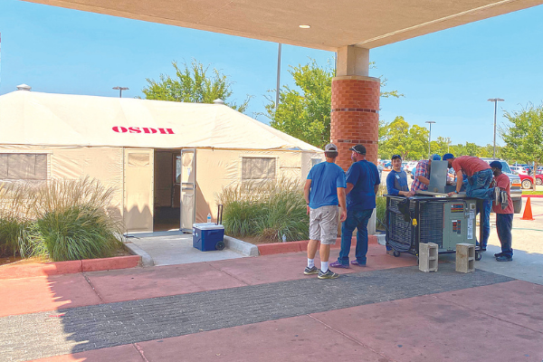 A tent used as an overflow waiting area is shown in front of the emergency room entrance at Comanche County Memorial Hospital in Lawton Tuesday. CARL LEWIS/LEDGER PHOTO