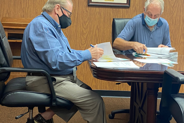  From the left, Comanche County Commissioners Johnny Owens and Gail Turner review documents before Monday's meeting. Eric Swanson/Ledger photo.