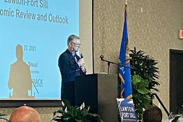 Mark Snead, president of the Oklahoma City-based economic research firm RegionTrack, addresses the audience during the Lawton-Fort Sill Economic Development Corp.'s annual luncheon Wednesday at the Hilton Garden Inn and Convention Center. Eric Swanson/Ledger photo.