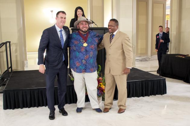 Oklahoma Gov. Kevin Stitt presents Alberto Rivas with a Community Service Award for leadership and volunteerism Tuesday during the 44th Oklahoma Governor’s Arts Awards.