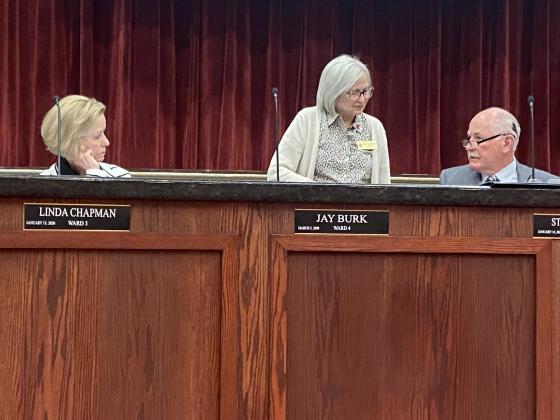 From the left, Lawton City Council members Linda Chapman and Mary Ann Hankins chat with Mayor Stan Booker before Tuesday’s meeting. The council approved the city’s proposed budget for fiscal year 2022-23, which calls for a 15% increase in utility rates and other service fees. Eric Swanson/Staff photo