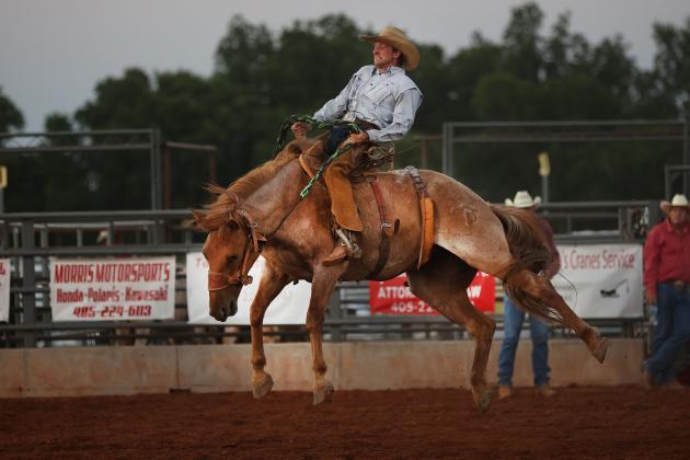 Garrett Tucker, of Elgin, competes in the first round of bronc riding at the Chickasha Open Rodeo held June 24-25 at the Grady County Fairgrounds. Tucker finished third in the competition. (Photo by Hugh Scott)