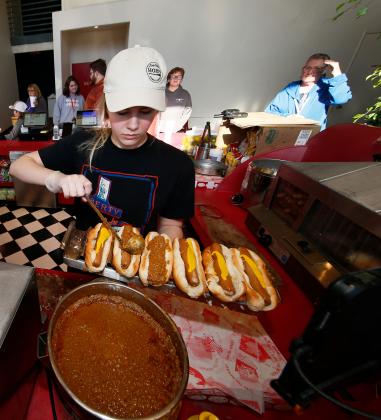 Jada Montgomery make chili dogs for patrons at Saturdays matinee screening of Avatar at the Liberty Movie Theatre in Carnagie.  Montgomery estimates she makes 300-500 chili dogs a day on the weekends. RIP STELL | SOUTHWEST LEDGER