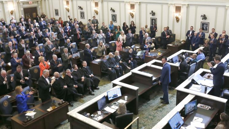 Oklahoma Governor Kevin Stitt, standing in the well of the House of Representatives, is greeted by applause as he prepares to deliver his State of the State speech. Seated directly in front of the governor are members of the Oklahoma Supreme Court. RIP STELL | SOUTHWEST LEDGER