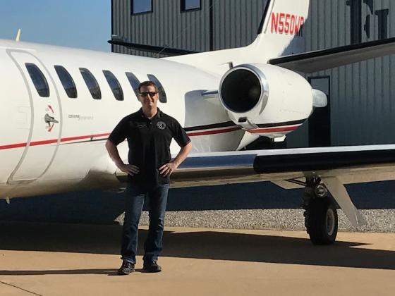 Martin Bohn, owner of AEROSPACE N3XT, stands next to a company-owned charter jet at Kickapoo Downtown Airport in Wichita Falls, Texas. PHOTO PROVIDED