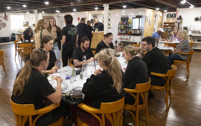 Customers enjoy the cuisine at the Garden Café while others stand in line to place their orders. The café offers salads, soups, sandwiches and desserts. HUGH SCOTT JR. | SOUTHWEST LEDGER