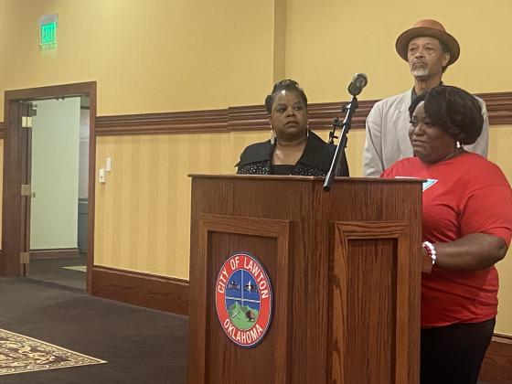 From the left, Sherene Williams, president of the Lawton branch of the NAACP, and Oklahoma Coalition Against People Abuse founder Michael Washington listen as Quadry Sanders’ mother, Mina Woods, speaks during a press conference June 15 at Lawton City Hall. Woods urged the city to uphold its decision to fire former police officers Robert Hinkle and Nathan Ronan, who have been charged with first-degree manslaughter in the shooting death of Quadry Sanders. ERIC SWANSON | SOUTHWEST LEDGER
