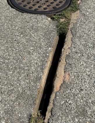 A related job was a $9,270 contract awarded to Mayfield on July 17 to clean out the clogged storm sewer and patch this hole in the pavement at 14th and Florida, which contributed to the damage a block away at 14th and Missouri. CURTIS W. AWBREY | SOUTHWEST LEDGER