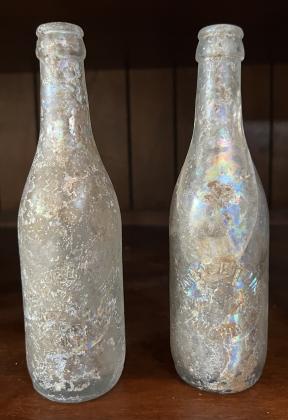 Artifacts to be displayed in the Savoy include a collection of old bottles, including these two bearing the name of “Farley’s Bottling & Manufacturing Co., Chickasha.” MIKE W. RAY | SOUTHWEST LEDGER