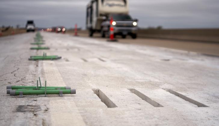 Metal dowel bars cemented into the grooves cut into the concrete pavement of the H.E. Bailey Turnpike strengthen the highway and prolong its lifespan. CHRISTOPHER BRYAN | SOUTHWEST LEDGER