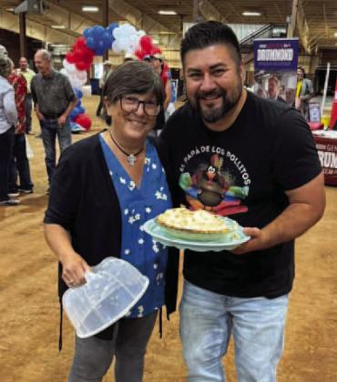 Photo by Wayne Watts Julie McKinney and Tony Lopez show off the $1,500 coconut cream pie bought during the 22nd annual Stephens County GOP Fish Fry on May 23 at the Stephens County Fairgrounds. The annual political fundraiser draws Republicans from all over the state. This year, SCGOP hosted a Republican gubernatorial candidate forum which drew approximately 900 visitors to the event.