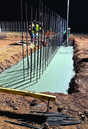 Photo provided Construction on this building at the Firehawk Aerospace site in northwest Lawton was underway at 4:45 a.m. Thursday, before the temperature soared to triple digits. A concrete foundation is being poured, and rebar has been installed to provide support for walls that will be up to 3 feet thick.