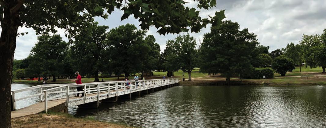 A family spends a Sunday afternoon fishing off the side of the pedestrian bridge at Chickasha’s Shannon Springs Park. The bridge was built approximately 80 years ago and its concrete piers show their age. Curtis W. Awbrey | Southwest Ledger