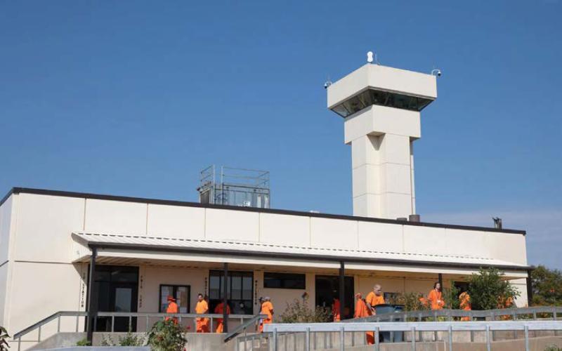 Brent Fuchs | Oklahoma Watch Prisoners move around the Joseph Harp Correctional Center. They will soon be allowed to purchase nicotine vapes and pouches.