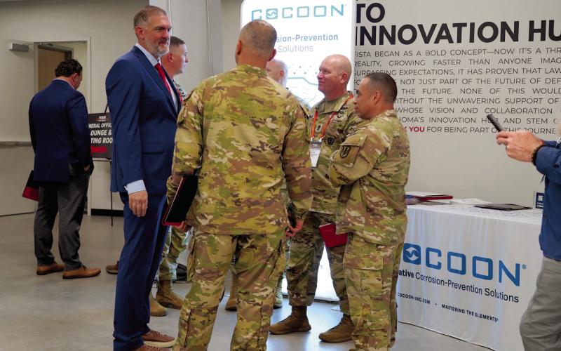 Ashley Payne | Southwest Ledger FISTA Director of Operations Bill Pearson visits with guests at the FIRES Symposium Wednesday at the FISTA Innovation Park..