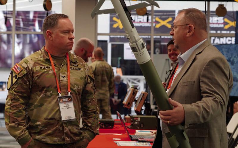 Ashley Payne | Southwest Ledger Col. David O’Leary hears a brief presentation by retired Col. Richard Bowyer with Saab Inc., a corporation that serves the U.S. government, industry, and commercial customers with worldleading products, services and solutions including defense and civil security. Saab Inc. was one of many companies set up at the FIRES Symposium, a weeklong convention held at the FISTA Innovation Park.