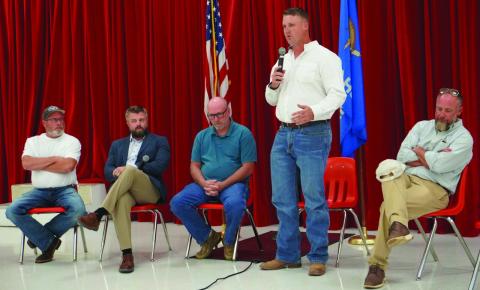 From the left, candidates Chad Maguire, Trent Logan, Chad Tracht and Dr. Hank Hasenbeck listen as candidate Ryan John speaks at a meet-and-greet event. The Comanche County GOP hosted the July 30 event, which gave District 1 voters a chance to meet the candidates. Eric Swanson | Southwest Ledger
